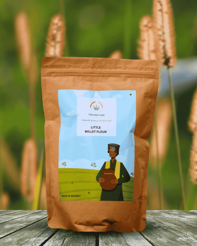 The Deep Soil Little Millet Flour package on wooden table with tall golden millet stalks background