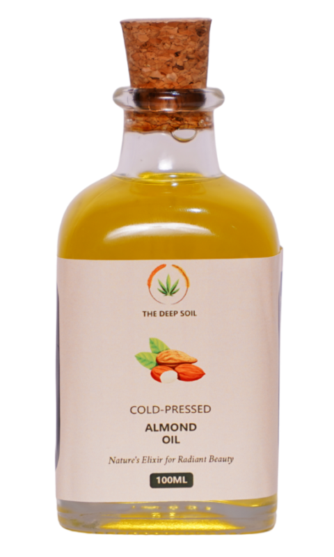 Cold-pressed almond oil in glass bottle by The Deep Soil, naturally extracted for skin, hair, and wellness use.