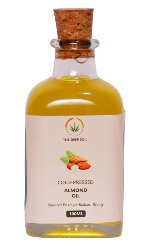 Cold-pressed almond oil in glass bottle by The Deep Soil, naturally extracted for skin, hair, and wellness use.