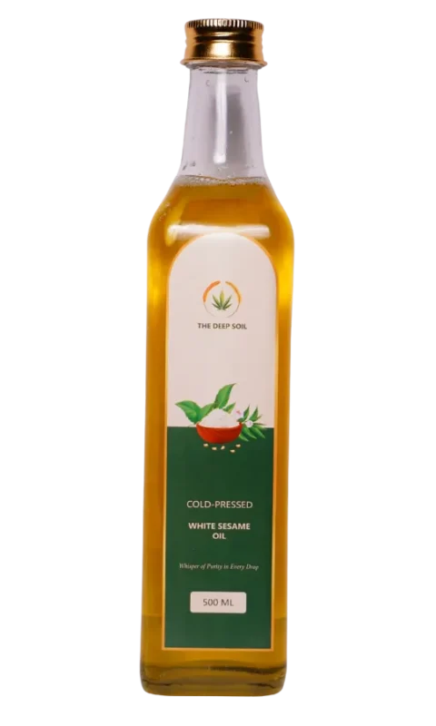 Cold-pressed white sesame oil in glass bottle by The Deep Soil, traditionally extracted and rich in natural nutrients.