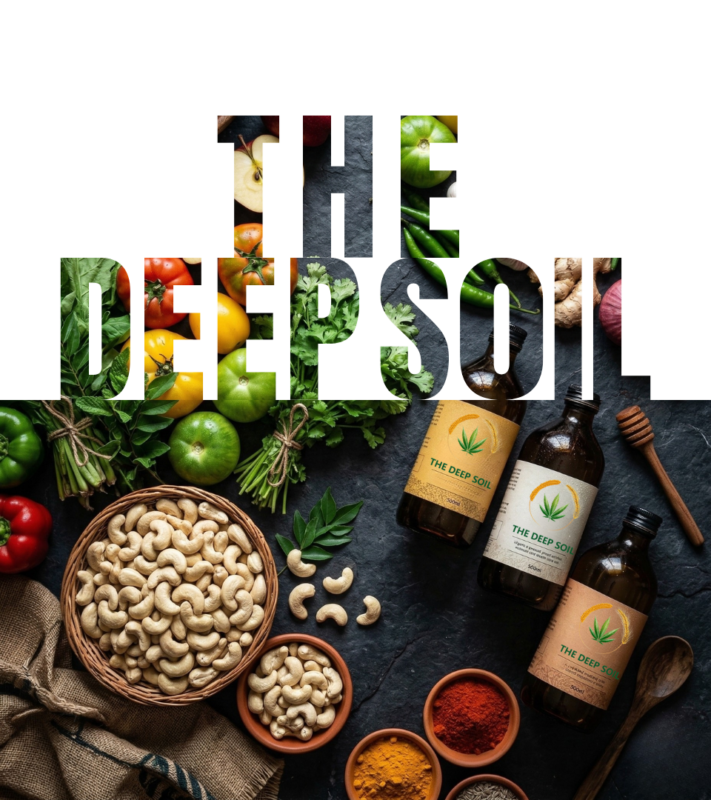 The Deep Soil organic food display featuring cashews, spices, fresh vegetables, and bottled natural oils on a dark slate background.